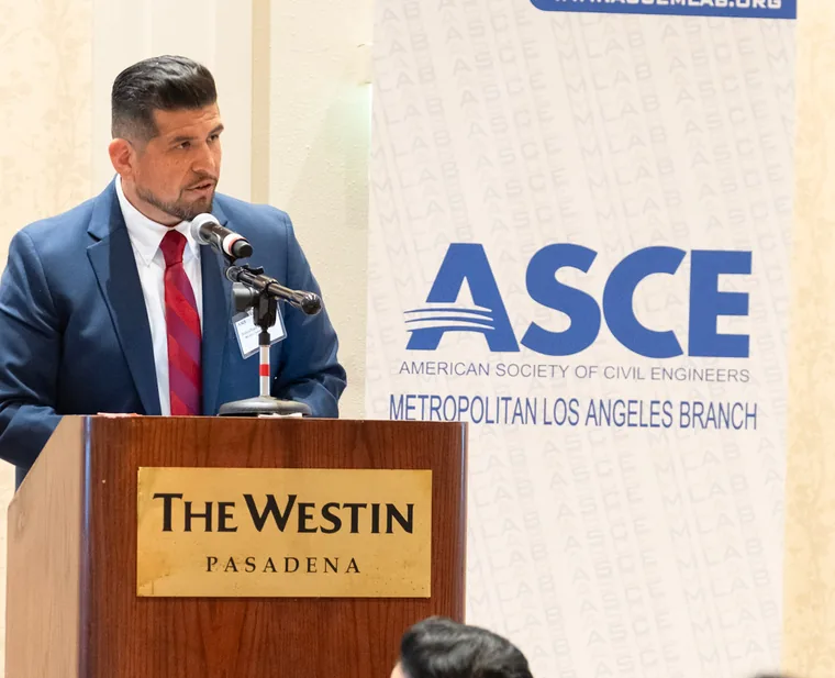 Jonathan Ontiveros speaking at a podium at an American Society of Civil Engineers event